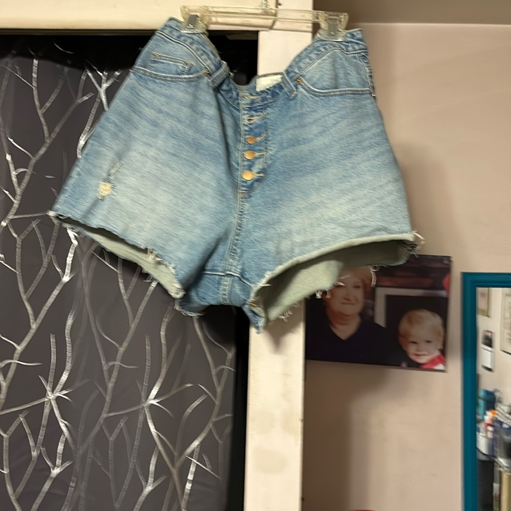 Distressed button up jean shorts with stretch